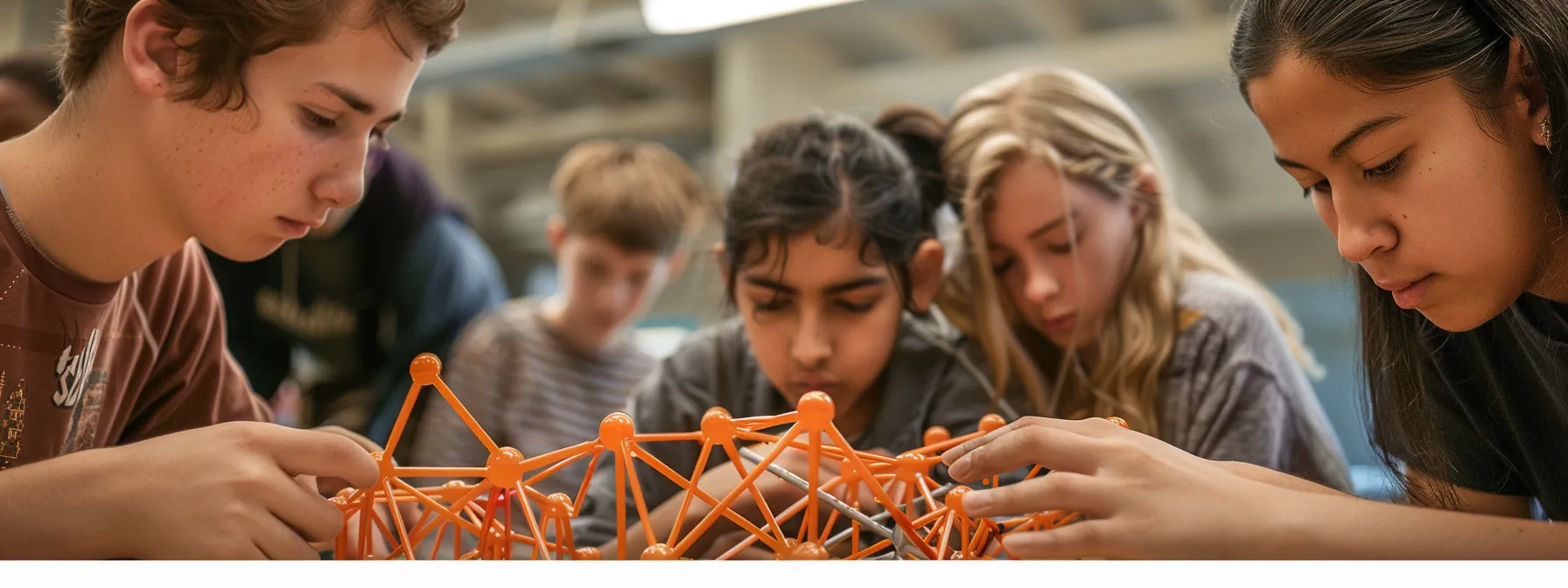 a group of young students working together to construct a miniature bridge, showcasing their creativity and problem-solving skills in engineering education.