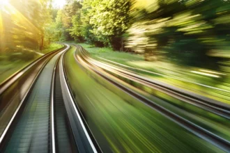 a sleek, futuristic train speeding through a lush green landscape.