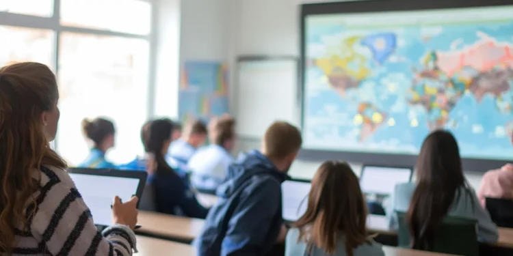 a group of travelers in a classroom receiving a comprehensive and interactive defensive foreign travel briefing.