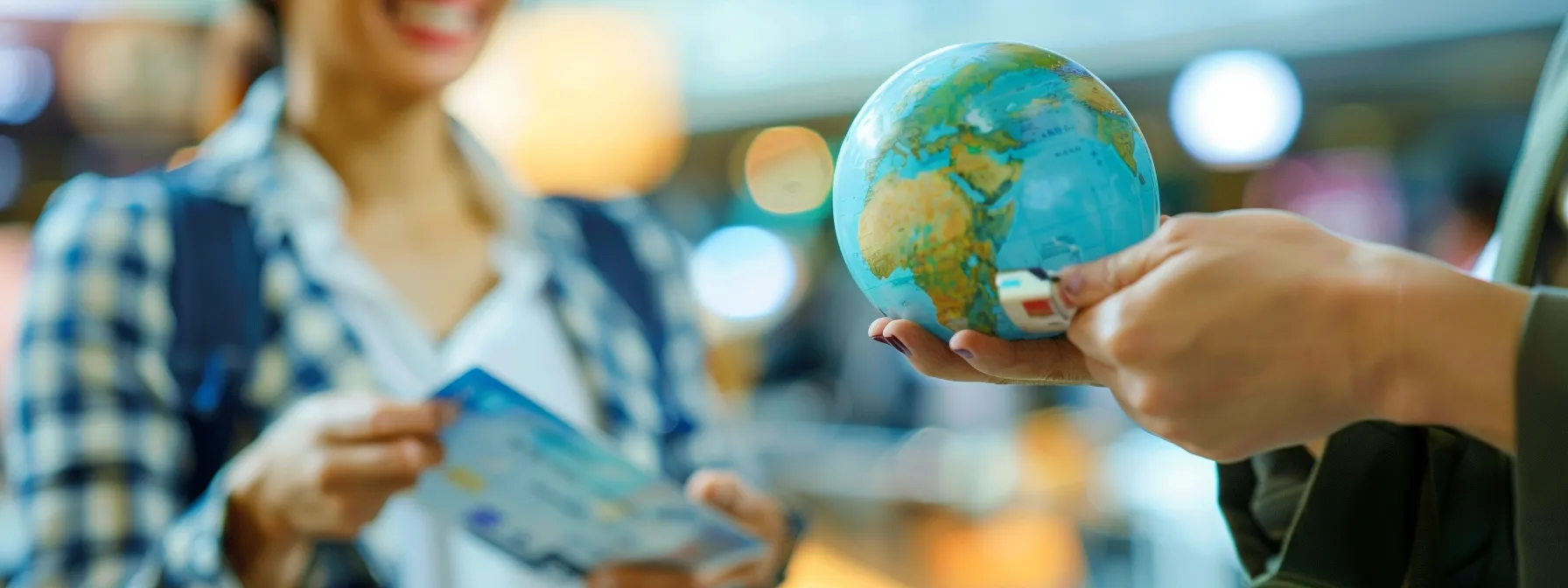 a traveler smiling as they receive a travel card with a globe in the background, showcasing the benefits of saving money with competitive exchange rates and favorable currency conversion rates.