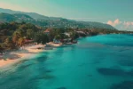 a vibrant jamaican beach with crystal clear turquoise waters and palm trees swaying in the warm tropical breeze, inviting you to explore its beauty.